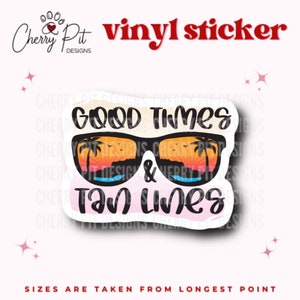 May include: A pink and white vinyl sticker with a pair of sunglasses with a sunset and palm trees reflected in the lenses. The text "GOOD Times & Tan Lines" is written in black on the sticker.
