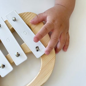 baby play with wooden handmade xylophone, kids musical toy