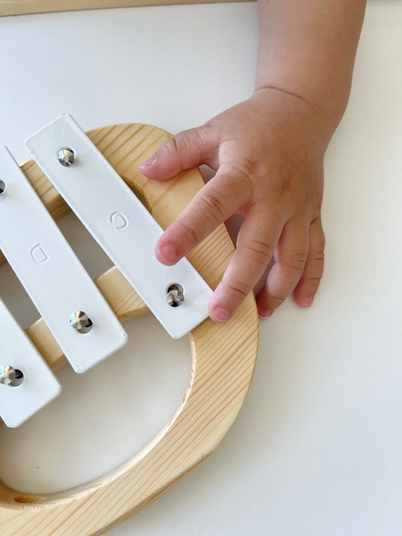 baby play with wooden handmade xylophone, kids musical toy