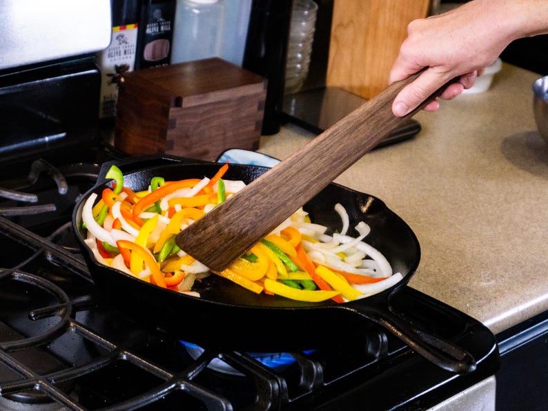 13 inch spatula at use sautéing veggies in cast iron skillet