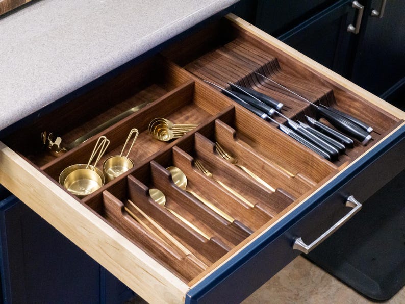 Drawer Organizer made in Walnut. Gold and or brass silverware and cooking utensils. Built in knife block with knives.