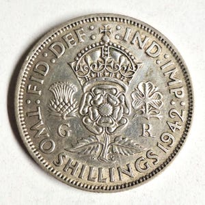 1942 United Kingdom silver two shilling coin in excellent condition! The coin you see is the coin you get!
