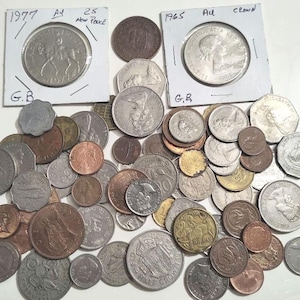 May include: A collection of various coins, including silver and copper pieces. Two coins are in protective holders, one dated 1977 with a horse and rider, and another from 1965. The coins vary in size and design, showcasing historical currency.
