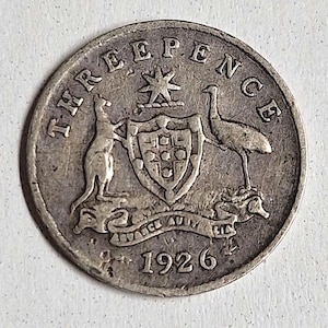 1926 Australian Silver Three pence coin in good condition. The coin you see is the coin you get!