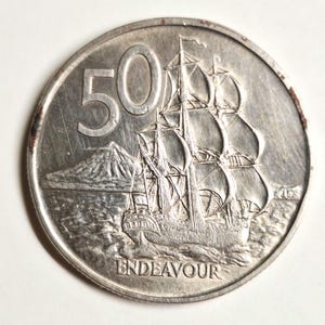 Queen Elizabeth II 1975 New Zealand half dollar coin featuring the legendary Ship the endeavour in high grade condition!
