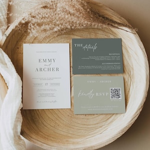 May include: A wedding invitation suite featuring three cards in a wooden bowl. The main invitation is white with the names "Emmy and Archer" and event details. Two smaller cards are sage green, one with "The Details" and the other with "Kindly RSVP".