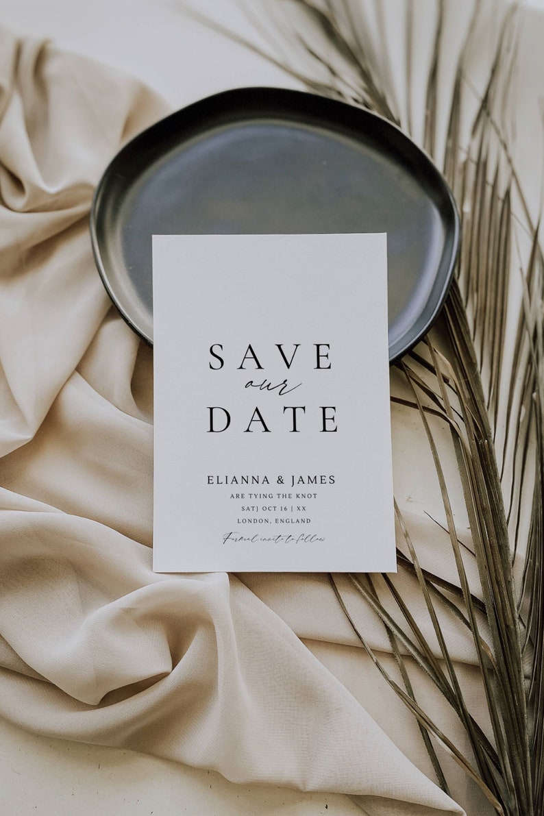 May include: A white save the date card with black text. The text reads "Save our Date" followed by "Elianna & James are tying the knot Sat) Oct 16 | XX London, England Formal invite to follow".