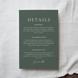 May include: A dark green wedding details card with white text. The card includes information about the reception, accommodations, and transportation. The text is in a simple, elegant font. The card is rectangular and has rounded corners.