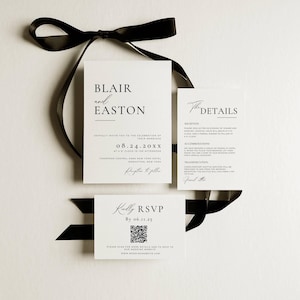May include: A set of white wedding invitations with black text and a black ribbon. The main invitation card reads "Blair and Easton" and includes the wedding date and location. A smaller card says "Kindly RSVP" with a QR code.