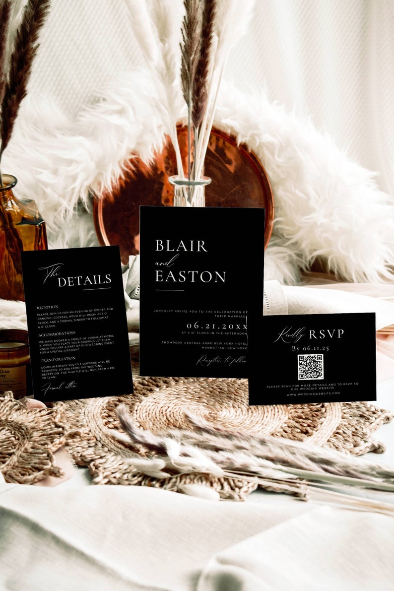 May include: Black and white wedding invitation cards with the names Blair and Easton, the date 06.21.20XX, and the location Thompson Central Park New York Hotel, Manhattan, New York. The RSVP card includes a QR code.