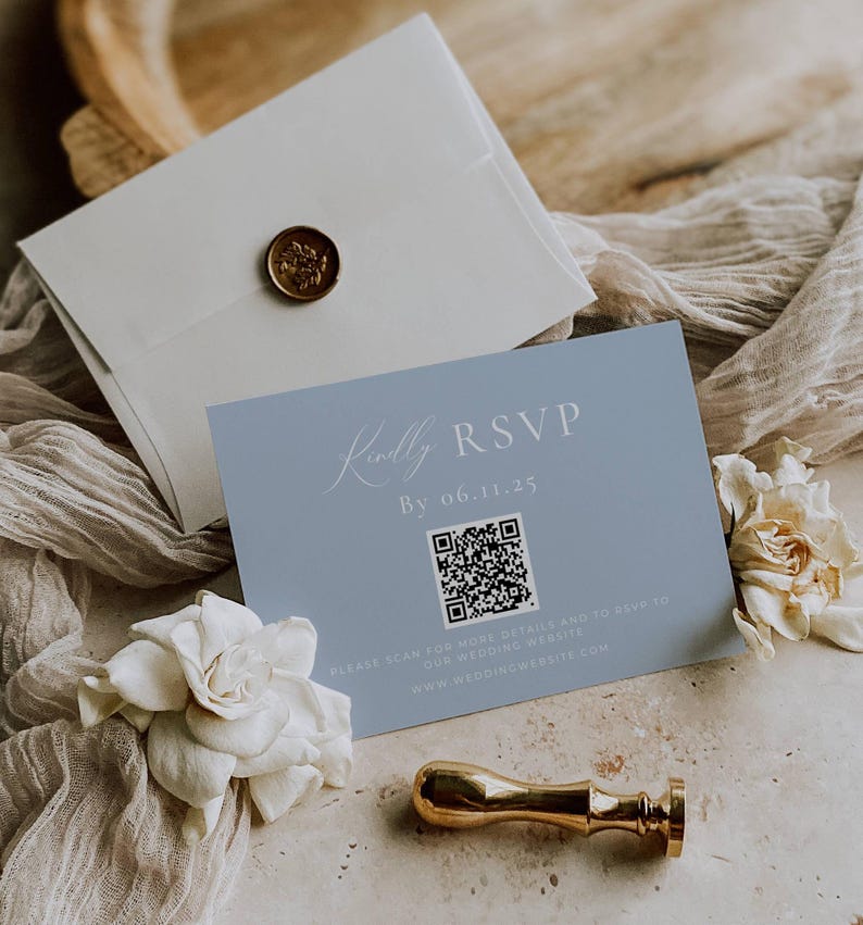 May include: A light blue RSVP card with a QR code and the text "Kindly RSVP by 06.11.25". The text "Please scan for more details and to RSVP to our wedding website www.weddingwebsite.com" is also included.