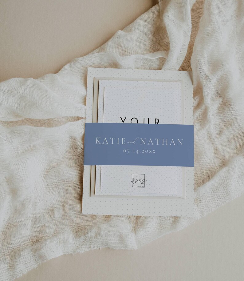 May include: A wedding invitation suite with a blue and white color scheme. The invitation features a white card with a blue band that says "Katie and Nathan" and the date "07.14.20XX".