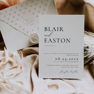May include: A wedding invitation with the names "Blair and Easton" in elegant black font. The invitation includes the date, time, and location of the ceremony. An envelope with polka dots and the text "Citrus Press Co." is also visible, along with a ribbon.