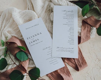 May include: Wedding ceremony program cards with white background and black text. The cards include the names "Elianna and James" and the date "Saturday, August 28, 2021". The cards also include a list of the wedding party.