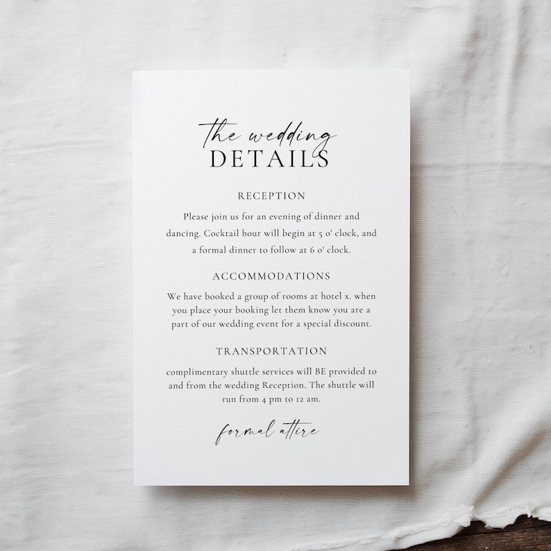 May include: A white wedding details card with elegant script. The card includes information about the reception, accommodations, and transportation. The text is in black, with the words "The wedding DETAILS" at the top.