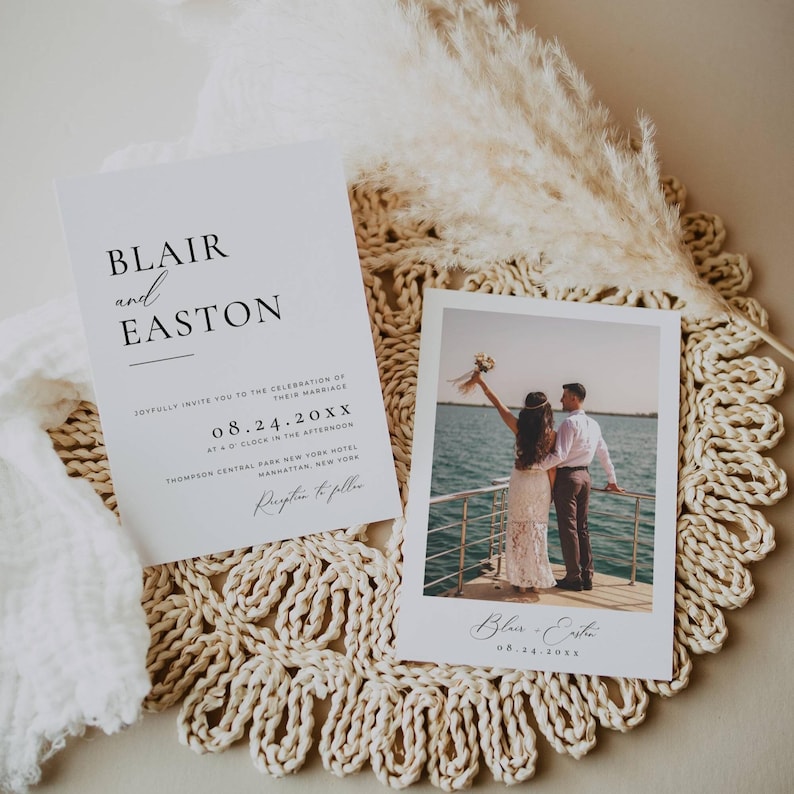 May include: A wedding invitation and a photo card are displayed on a textured, beige surface. The invitation features the names "Blair and Easton" in elegant black font, along with event details. The photo card shows a couple on a boat, celebrating their marriage.