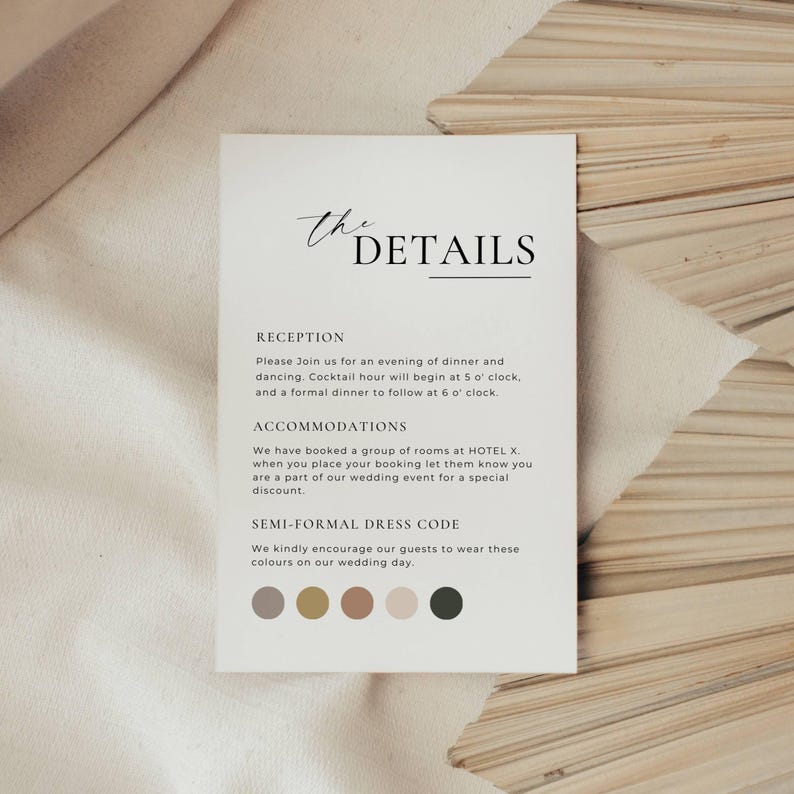 May include: A white card with the text "THE DETAILS" in elegant script and a list of wedding event information. The card includes details about the reception, accommodations, and dress code, with a color palette at the bottom.