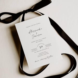 May include: A white wedding invitation with black script and a black ribbon. The invitation reads "Alessandra & Jameson" and includes the date "September 30". The text "dinner & dancing to follow" is also included.