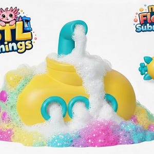 May include: A yellow submarine toy with a blue periscope and portholes, surrounded by colorful foam. The toy is labeled "new Floater Submraine" and "STL Things". The foam is a mix of pink, yellow, and blue.