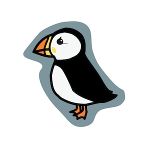 May include: A sticker featuring a stylized illustration of a puffin with a black back, white chest, and a multi-colored orange, yellow, and black beak. The bird has a small yellow cheek patch and orange webbed feet, set against a gray border.