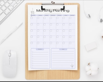 May include: A printable monthly planner with a light purple and white color scheme. The planner has a section for each day of the week, a section for priorities, and a section for notes. The planner is on a clipboard with a wooden frame.