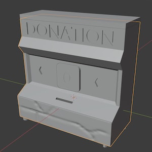 Pode incluir: Uma caixa de doações cinza com uma fenda para dinheiro. A caixa tem uma placa que diz "DONATION" e duas setas apontando para a esquerda.