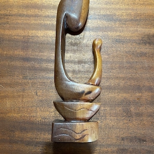 Wood carved statue mother and child vibe