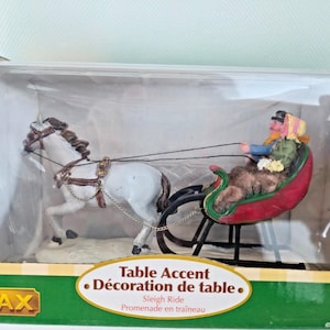 May include: A white ceramic mug with a black handle and the text "But First, Coffee" in a handwritten style. The mug is likely 11-15 ounces, perfect for a morning beverage.