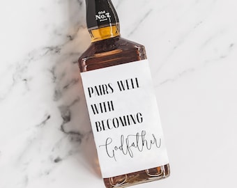May include: A brown glass bottle with a white label that says "Pairs well with becoming Godfather".