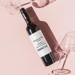 a bottle of wine next to a wine glass