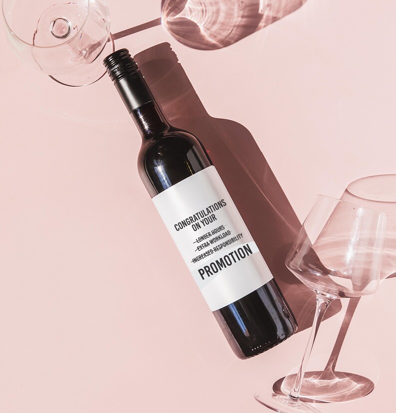 a bottle of wine next to a wine glass