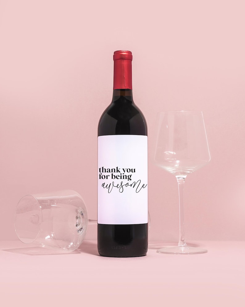 a bottle of wine next to a wine glass
