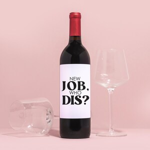 a bottle of wine next to a wine glass
