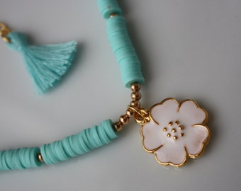 blue fimo necklace with flower figures