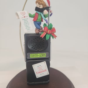 ENESCO 1996 &quot;Santa&#39;s On The Line&quot; Plays various Christmas Tunes New in box, tested. Treasury of Christmas Ornaments