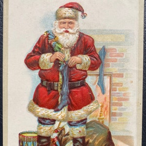 VGC Rare Vintage Sander Christmas Postcard Santa Claus Put Toys in Stockings Fireplace Gold Gilded Textured Embossed Antique Unsent 447