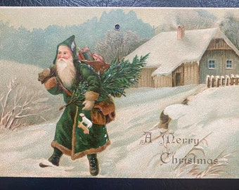 Rare Vintage German Merry Christmas Postcard Belsnickle Trek Thru Snow w/ Toys Tree Cabin Textured Embossed Antique Unsent 470 *hole punched