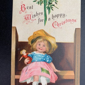 Antique Girl Doll Christmas Signed Ellen Clapsaddle German Vintage Postcard Child on Bench Doll Mistletoe Best Wishes Happy Embossed