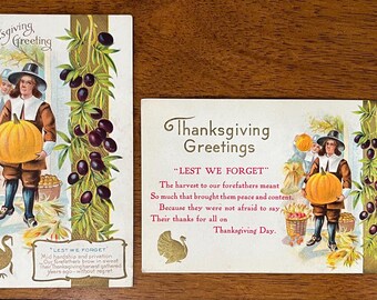May include: Two vintage Thanksgiving greeting cards with illustrations of pilgrims and harvest scenes. The text on the cards reads "Thanksgiving Greetings" and "Lest We Forget".