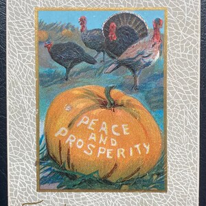 May include: Vintage Thanksgiving postcard featuring turkeys, a pumpkin with "Peace and Prosperity" text, and "Thanksgiving Greetings" text. The card has a decorative gray and gold border.