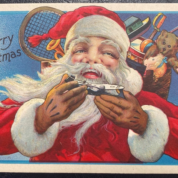 GC+ Rare Vintage Merry Christmas Postcard Santa Claus w/ Toy Sack Play Airplane Toy Racket Teddy Bear Textured Embossed Antique Unsent