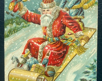 Vintage Rare 1907 German Christmas Postcard Belsnickle Santa Sledding w/ Child Deliver Jester Gold Gilded Textured Embossed Antique Sent 7k