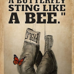 May include: A motivational poster with the quote "FLOAT LIKE A BUTTERFLY STING LIKE A BEE."  The poster features a pair of black boxing gloves hanging from a hook with a butterfly perched on one of the gloves.