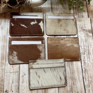 Cartera para tarjetas de crédito de piel de vaca con pelo occidental Myra Bag Texas