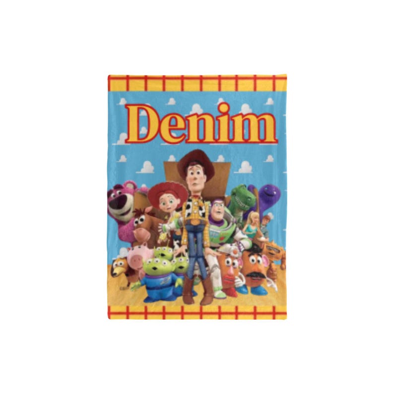 May include: A blue blanket featuring the word "Denim" in large orange letters. The blanket has a cartoon image of characters from the movie Toy Story. The characters include Woody, Buzz Lightyear, and others.