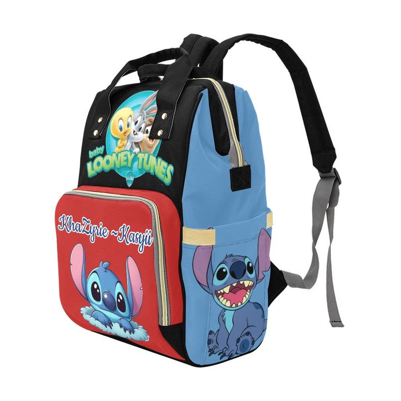 May include: A black, blue, and red backpack featuring a Baby Looney Tunes logo on the top front, a red front pocket with the text KhaZyrie ~ Kasyii and a blue Stitch character, and a blue side panel with a large, smiling Stitch character graphic.