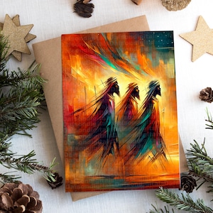 May include: Greeting card featuring an abstract painting of three figures in flowing robes, rendered in warm tones of orange, red, and yellow. The figures are silhouetted against a vibrant background, evoking a sense of movement and spirituality. The card is on a brown envelope.