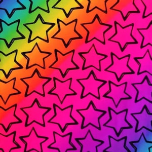 May include: Rainbow fabric with a black outline of stars repeating across the surface. The fabric has a gradient of colors from green to blue to purple to pink to orange to yellow.