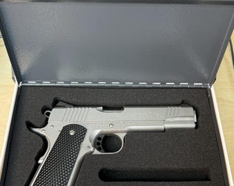 Book safe with custom cut foam for firearm.   (Remington R1 shown).  Laser engraved.  Veteran owned small business.
