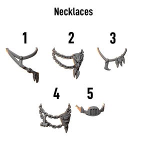 May include: An image of five necklaces, each with a unique design. The necklaces are numbered 1 through 5. The word "Necklaces" is printed above the necklaces. The logo for Greytide Studio is in the upper left corner.